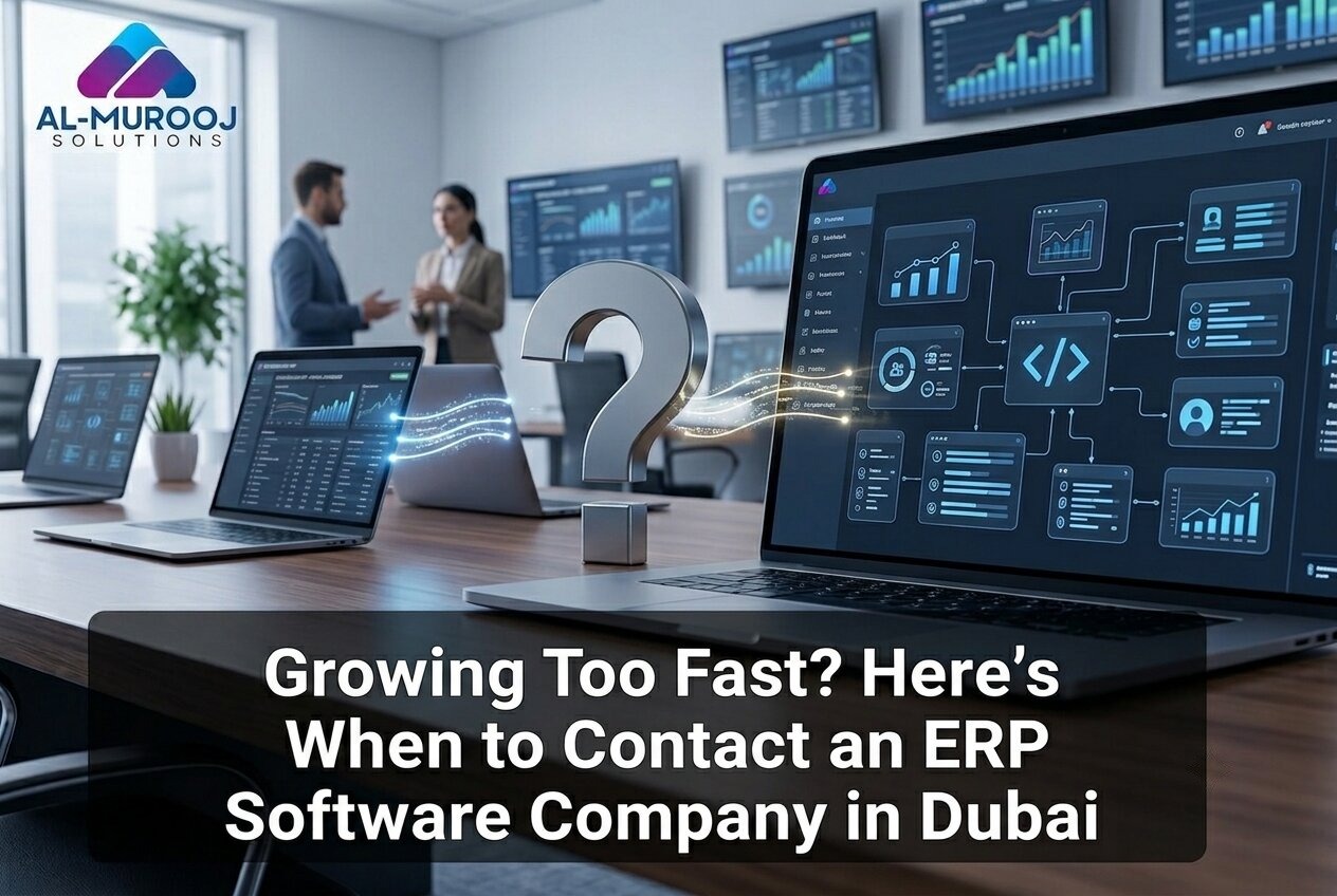ERP software company in Dubai dashboard showing connected business data on laptops and screens in a modern office